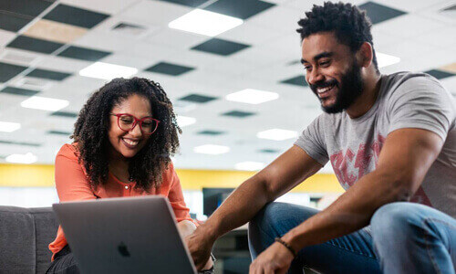 Two people at computer Two people at computer